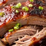 Tender homemade BBQ ribs baked until sticky and caramelized with a sweet smoky sauce