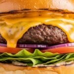 juicy homemade burger with melted cheese lettuce tomato