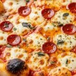 Homemade pizza with crispy crust, bubbly melted mozzarella, and golden edges fresh from the oven