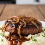 Homemade Salisbury Steak with Rich Onion Gravy Homemade Salisbury steak with rich onion gravy served over mashed potatoes