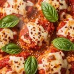 Spicy Pizza Chicken (One-Skillet, Cheesy & Packed With Bold, Rustic Flavor) Spicy pizza chicken cooked in a skillet with tender chicken pieces, tomato sauce, melted mozzarella, and fresh basil