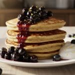 chickpea flour pancakes topped with blueberry compote