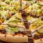 Homemade Big Mac Pizza Recipe Homemade Big Mac pizza with beef cheese lettuce pickles and sauce on crispy crust