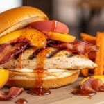 grilled chicken sandwich with peaches bacon and hot honey