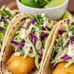 crispy fish tacos with golden fried fish cilantro lime slaw and corn tortillas