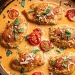 Creamy tomato chicken cooked in a skillet with tender chicken pieces and rich tomato sauce
