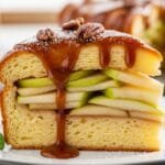 Caramel Apple Stuffed French Toast Casserole Slice of caramel apple French toast bake showing custardy bread layers