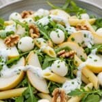 Sweet and savory pear pasta salad with fresh pears, mozzarella, arugula, and creamy yogurt dressing