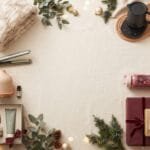 9 Trending Gifts for Women She’ll Actually Use A stylish Christmas gift scene on a warm cream background with several gift categories arranged naturally around the center