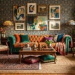 12 Maximalist Living Room Ideas for a Bold and Cozy Home Colorful maximalist living room with patterned decor, layered rugs, artwork, vintage furniture, and cozy accessories.
