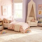 Cute toddler girl bedroom with a cozy bed, toy storage, reading nook, soft rug, and playful decor.