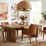 Stylish dining room with a wooden table, upholstered chairs, warm lighting, and elegant furniture